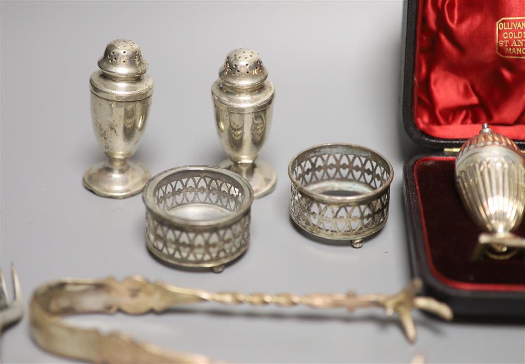 A cased pair of Victorian silver peppers, Sheffield, 1891, 79mm, five other silver condiments, etc.